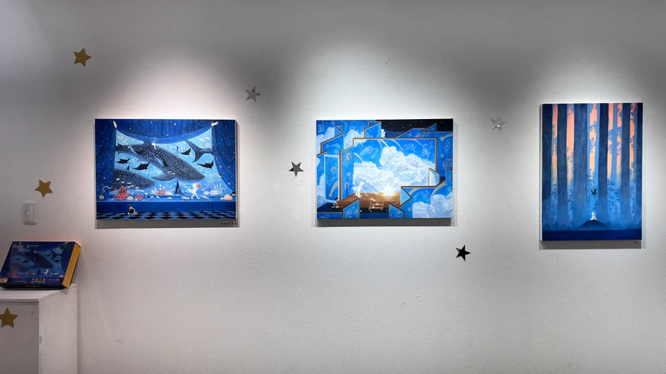In Between: three blue paintings and star decorations